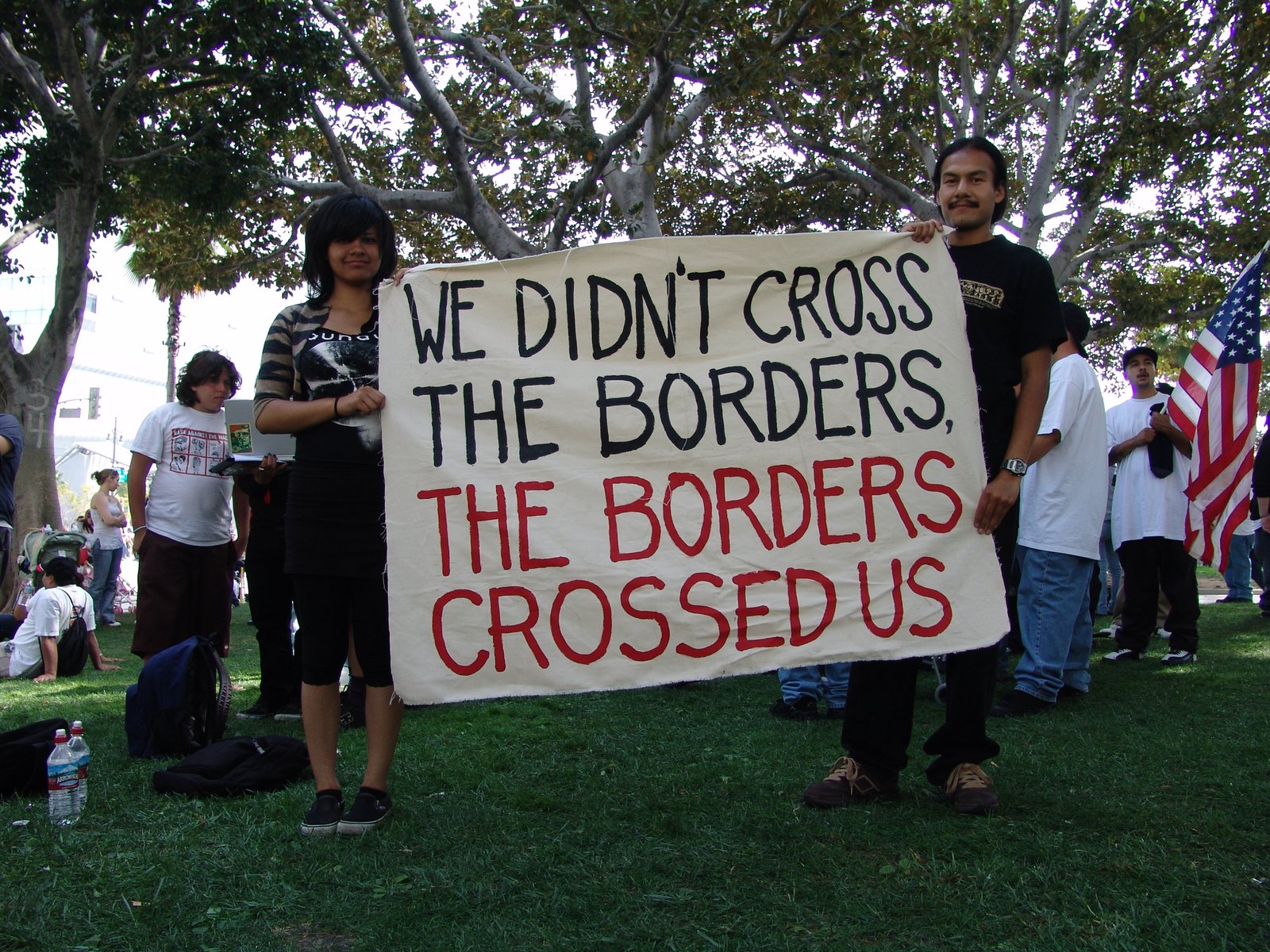 Participants holding an immigrant-rights banner at the May Day march in Los Angeles